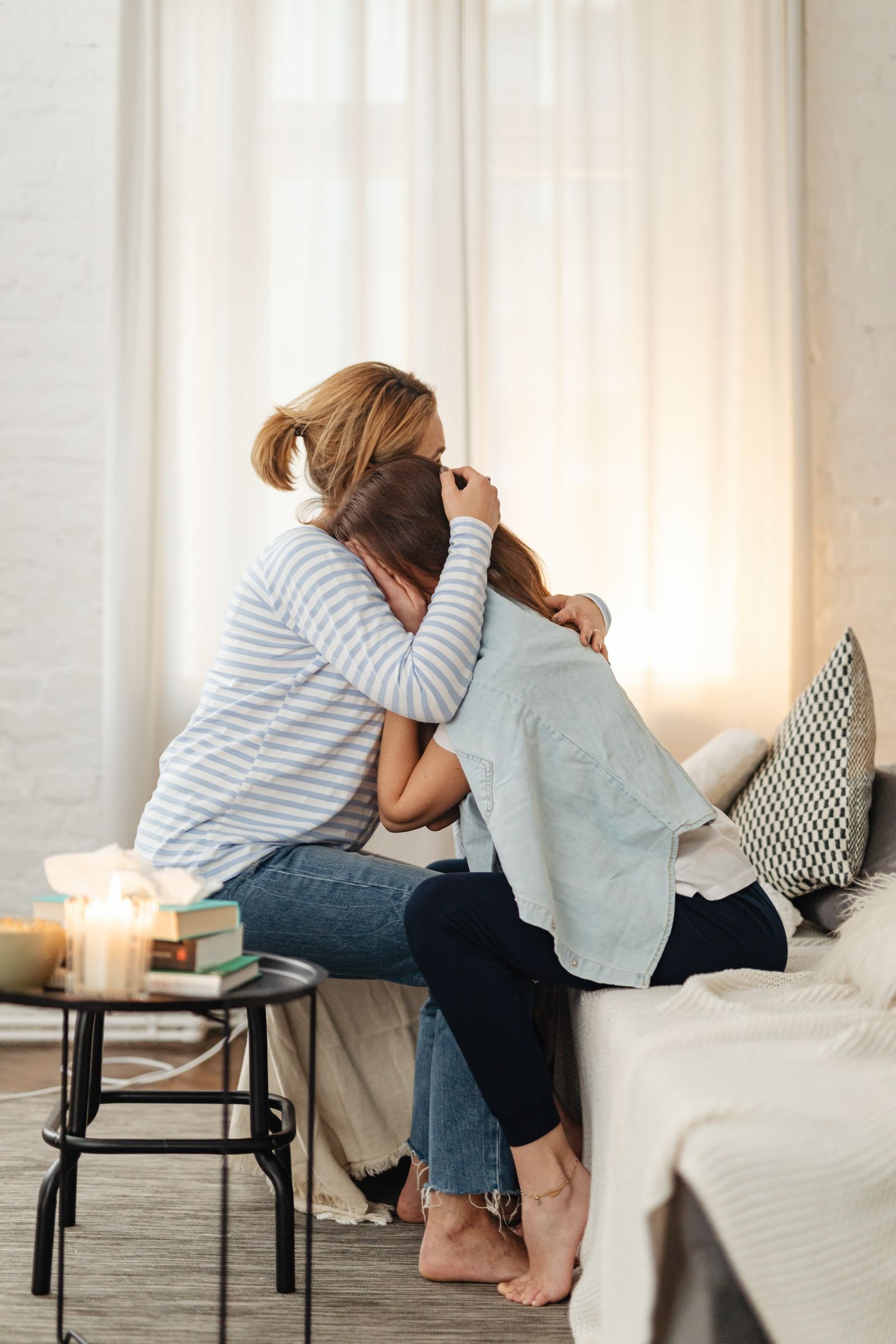 A caregiver and a senior sharing a warm moment at home