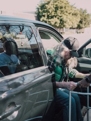 Caregivers helping a senior stay mobile and get out and about